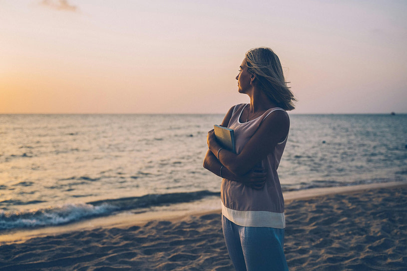 pexels-anntarazevich-6711881 Friday motivational quotes a girl with book on hand on riverside